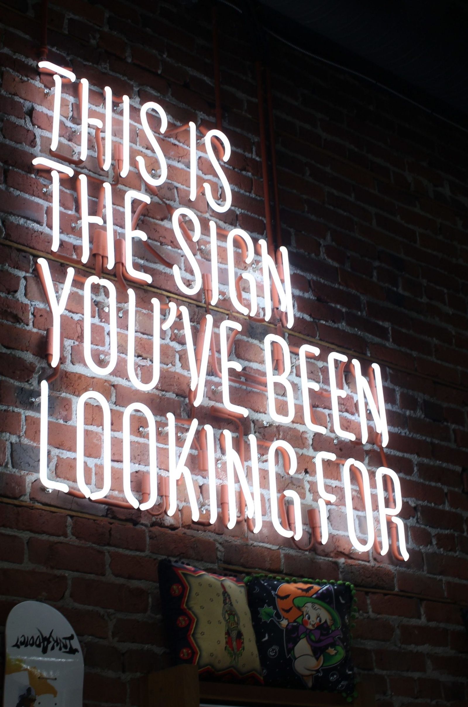 Neon sign reading “This is the sign you’ve been looking for” (illustrative image)
