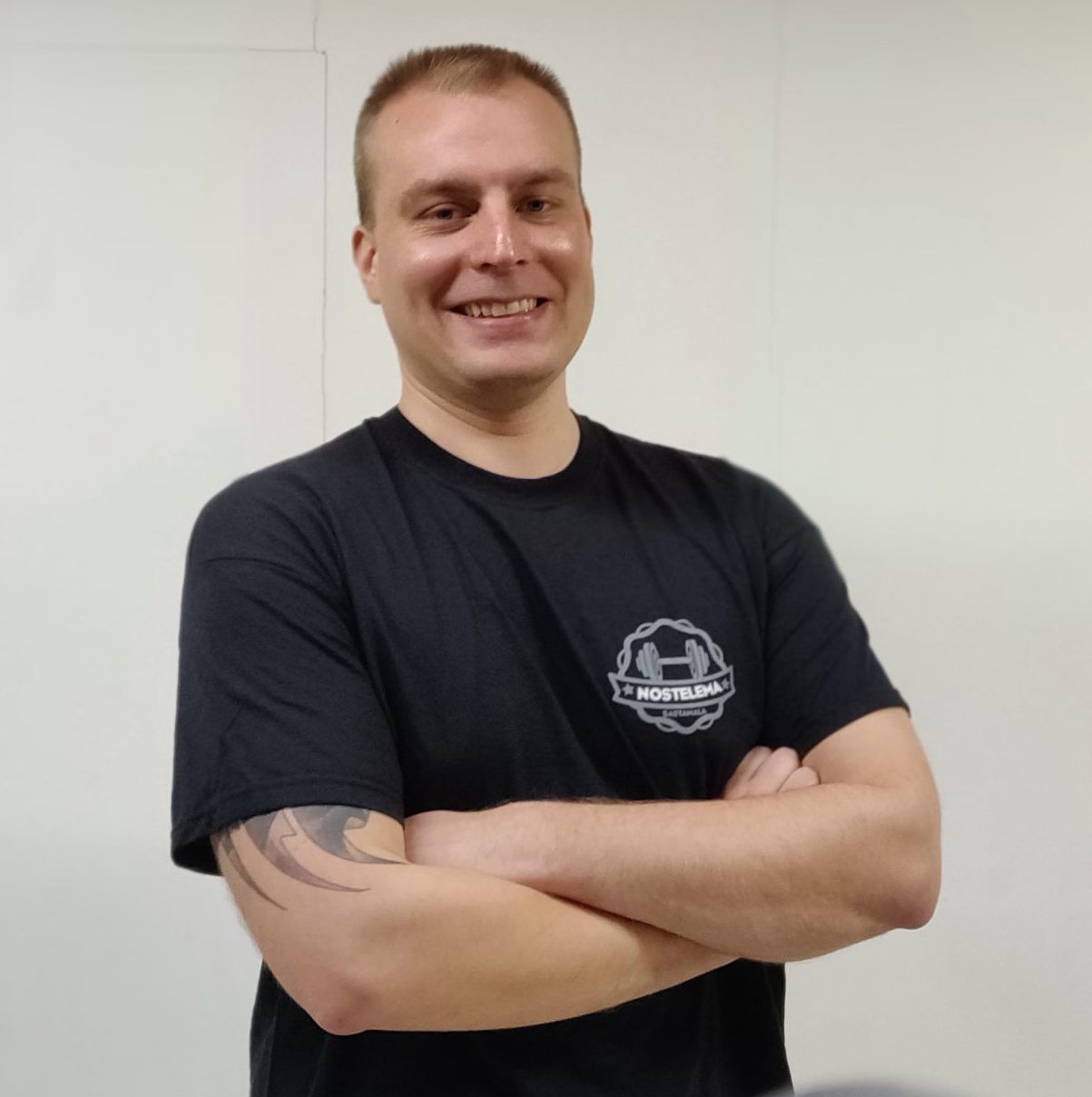 A Nostelema member in a black Nostelema T-shirt