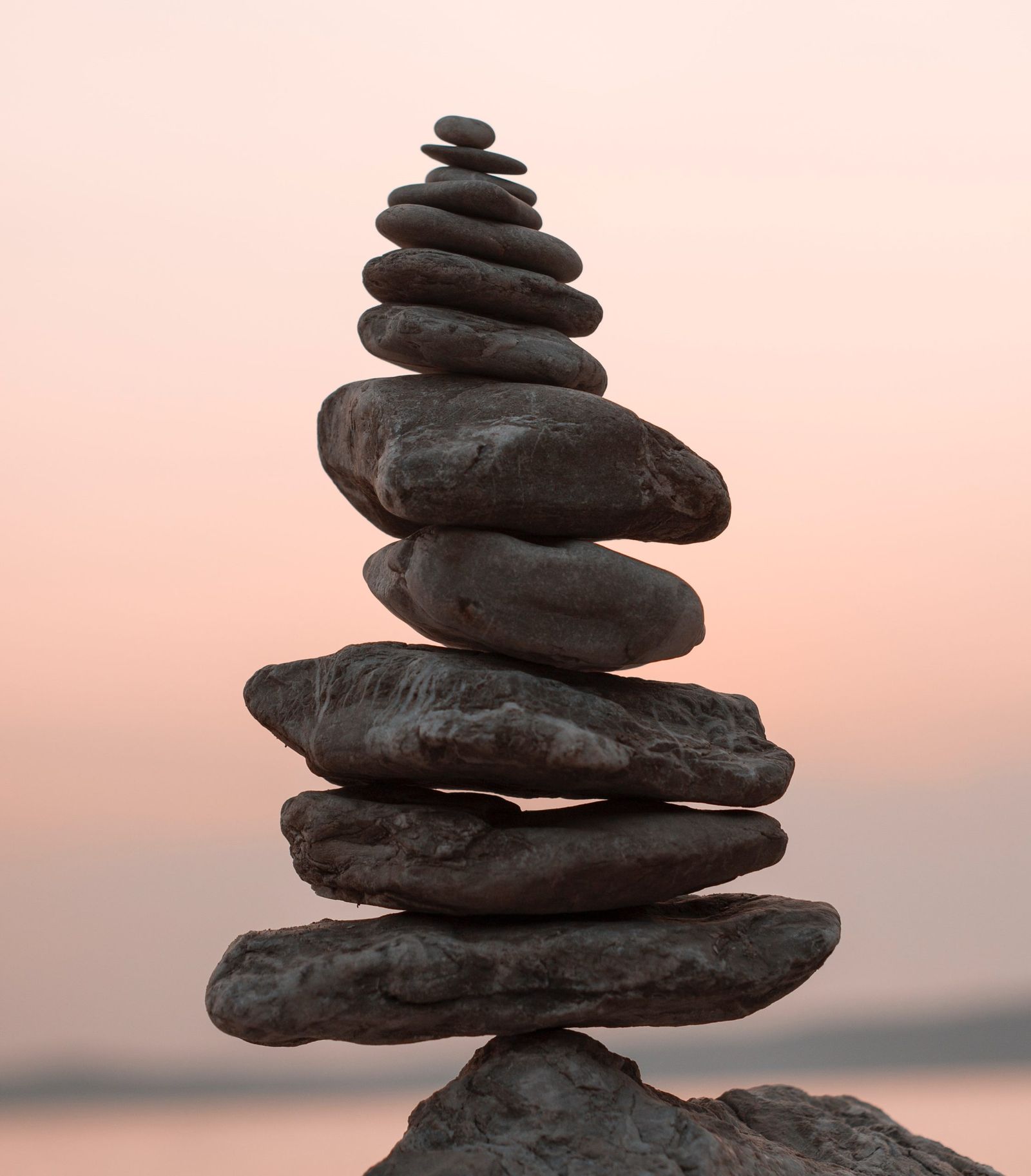 Balanced stones at sunset (illustrative image)