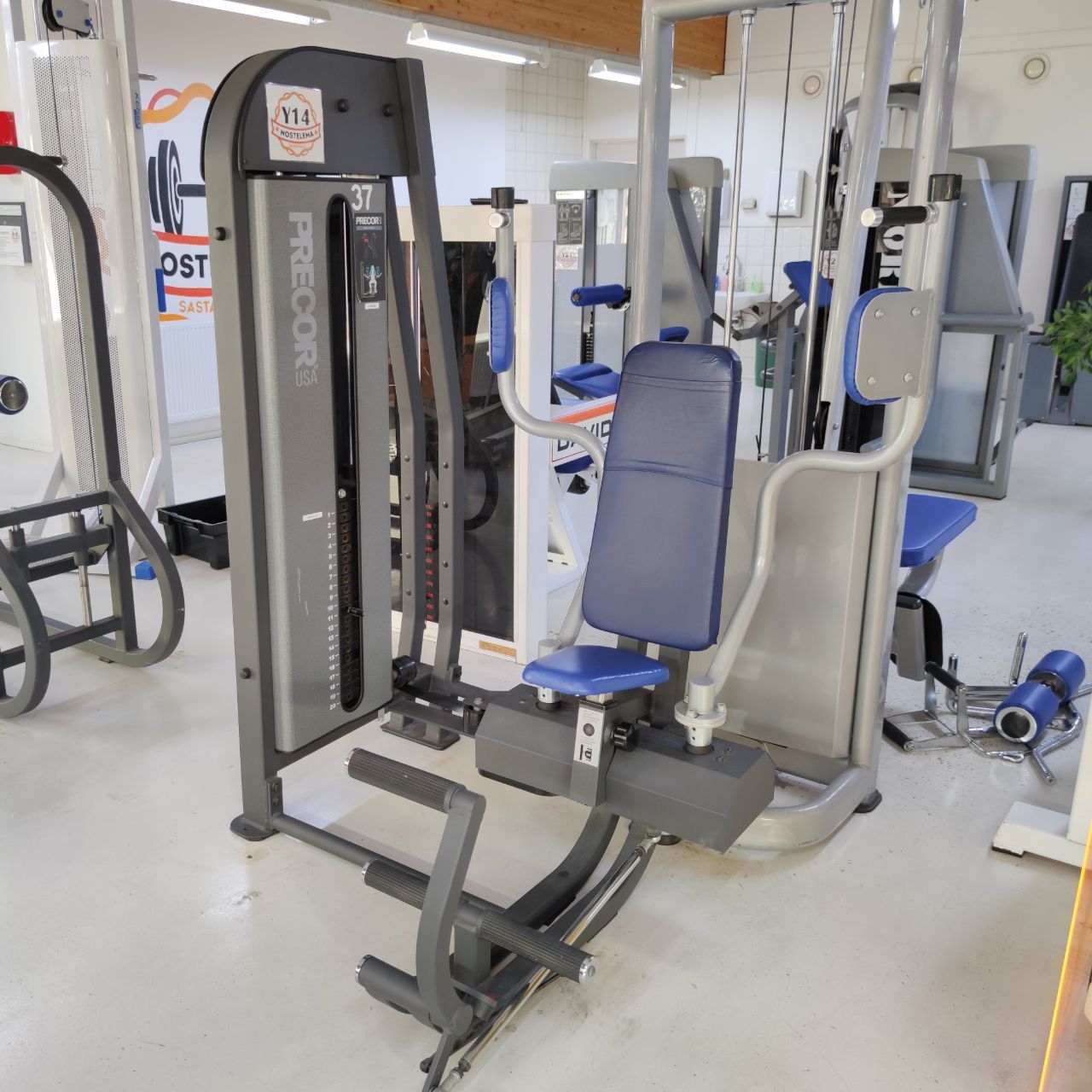 Precor chest machine (pec deck) with a seat and forearm pads