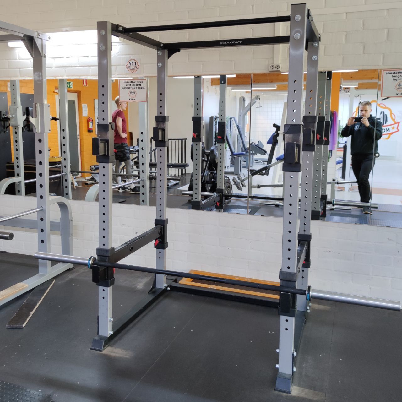 Squat rack (power rack) and a barbell with plates at Nostelema